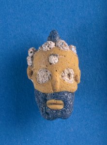 Pendentif à tête grotesque, objet de commerce phénicien de Syrie, VIe-IVe siècle av. J.-C.
